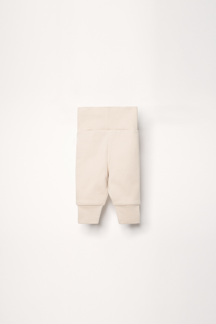 Baby pants in color sand with embroidered heart
